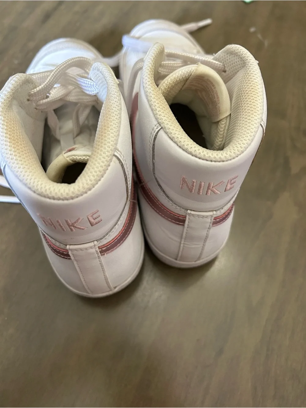 Nike High-Top Sneakers in White with Pink Swoosh